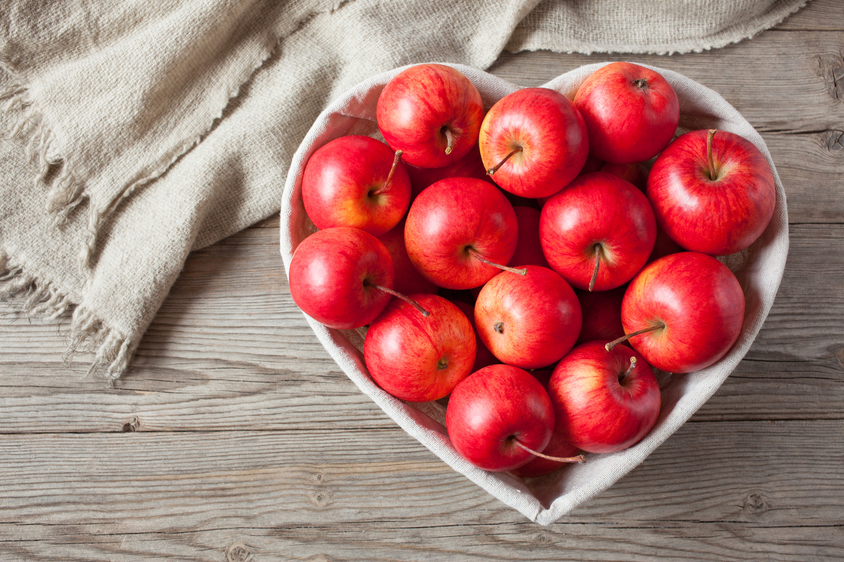 apples in a heart shaped bowl