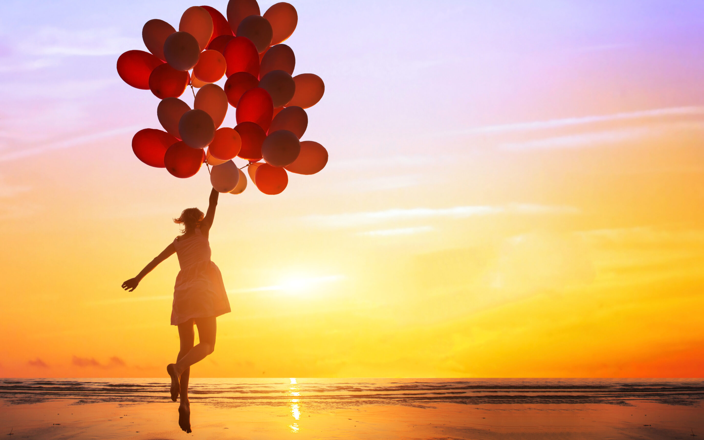 Happiness Concept, Happy woman jumping with balloons