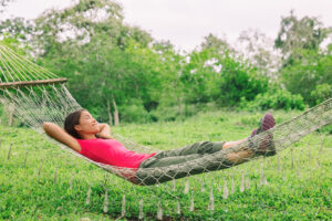 Woman relaxing on hammock